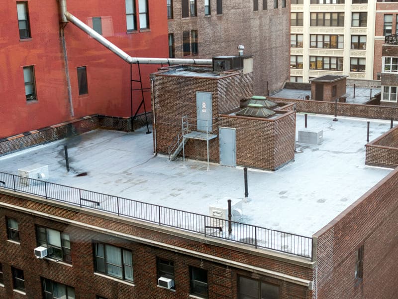 A building with a roof, representing C. Johnston Roofing & Waterproofing's services in Manhattan, NY