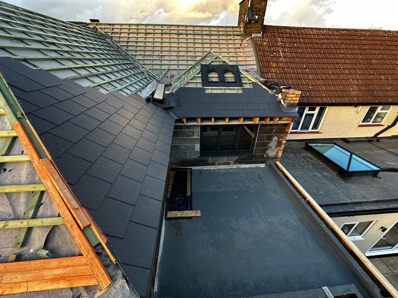 Emergency roofing services by C. Johnston Roofing & Waterproofing, featuring a rooftop view.